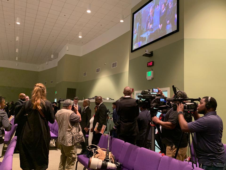 Civil Rights attorney Ben Crump, Rev. Al Sharpton and Bettersten Wade enter the New Horizon Church sanctuary Monday in Jackson.