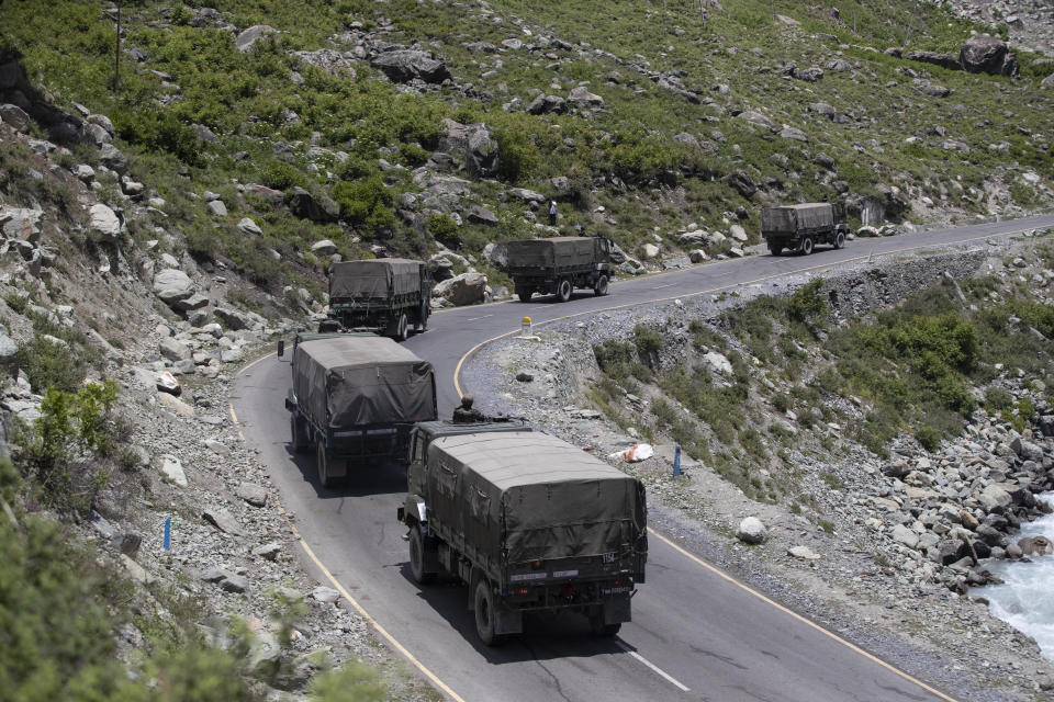 An Indian army convoy moves on the Srinagar- Ladakh highway at Gagangeer, north-east of Srinagar, India, Wednesday, June 17, 2020. Indian security forces said neither side fired any shots in the clash in the Ladakh region late Monday that was the first deadly confrontation on the disputed border between India and China since 1975. China said Wednesday that it is seeking a peaceful resolution to its Himalayan border dispute with India following the death of 20 Indian soldiers in the most violent confrontation in decades. (AP Photo/Mukhtar Khan)