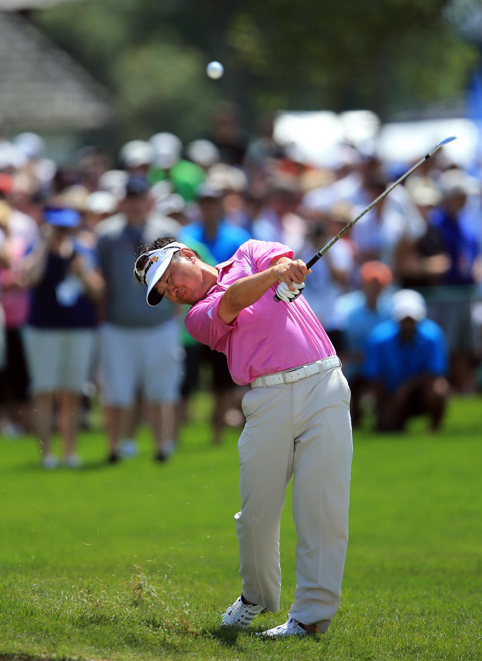 ORLANDO, FL - MARCH 24: Charlie Wi of the USA plays his second shot at the par 4, 1st hole during the third round of the 2012 Arnold Palmer Invitational presented by MasterCard at Bay Hill Club and Lodge on March 24, 2012 in Orlando, Florida. (Photo by David Cannon/Getty Images)