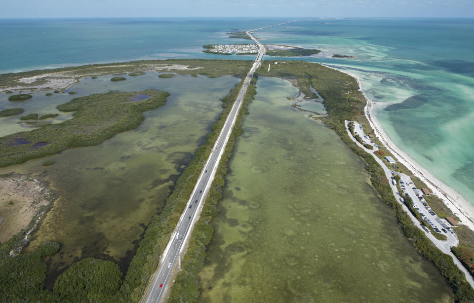 This March 10, 2013, photo provided by the Florida Keys News Bureau shows traffic on the Florida Keys Overseas Highway at Bahia Honda Key, Fla. The toll-free road connects inhabited islands in the Florida Keys archipelago and features 42 bridges over the water. (AP Photo/Florida Keys News Bureau, Andy Newman)