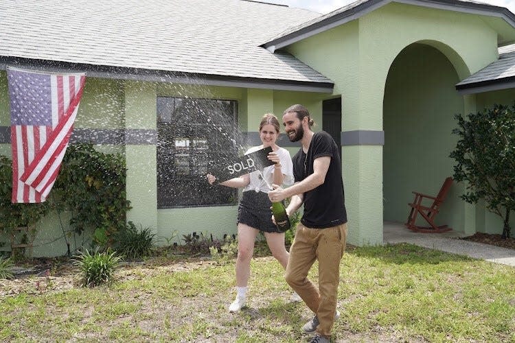 Erin and Connor Ennis celebrate the purchase of their home in northwest Palm Bay, a deal that closed in April.