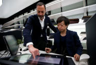 Infiniti, Nissan Motor's premium brand, Executive Design Director Karim Habib (L) looks at a monitior with Creative Design Manager Hideo Komuro at its Global Design Center in Atsugi, Japan, April 18, 2018. Picture taken April 18, 2018. REUTERS/Toru Hanai