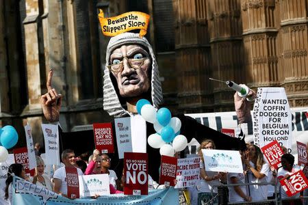 Anti "assisted dying" campaigners protest outside the Houses of Parliament in central London, Britain September 11, 2015. REUTERS/Stefan Wermuth