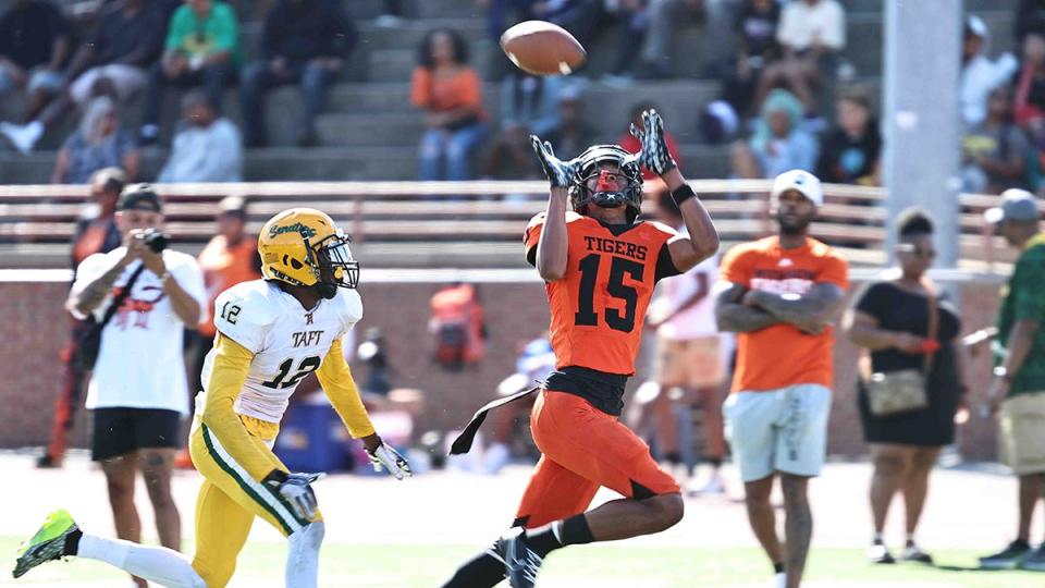 Withrow wide receiver Chris Henry Jr. (15) catches a touchdown pass in front of Taft's Quinton Price (12) during the Tigers' win Saturday, Sept. 23. 2023.