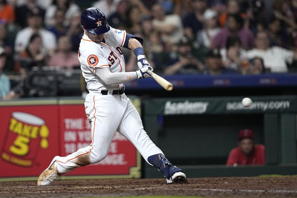 Houston Astros' Alex Bregman hits a two-run single against the Los Angeles Angels during the fifth inning of a baseball game Thursday, June 1, 2023, in Houston. (AP Photo/David J. Phillip)