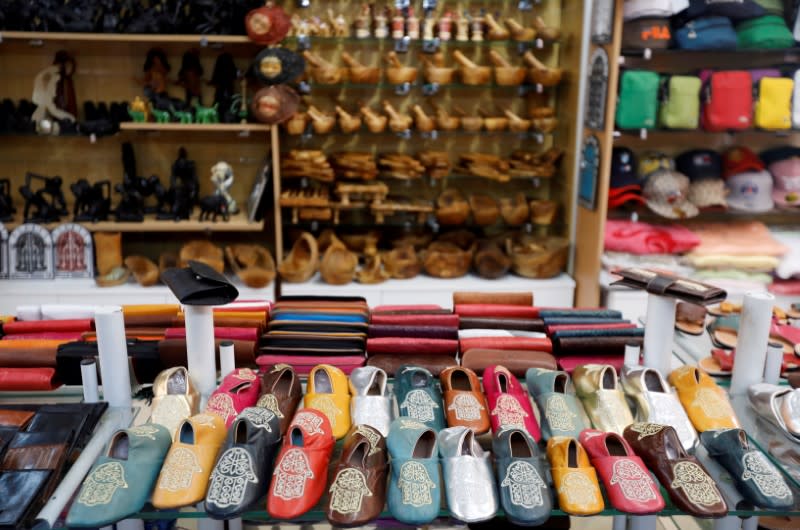 FILE PHOTO: Souvenir items are displayed for sale at an empty shop in Hammamet