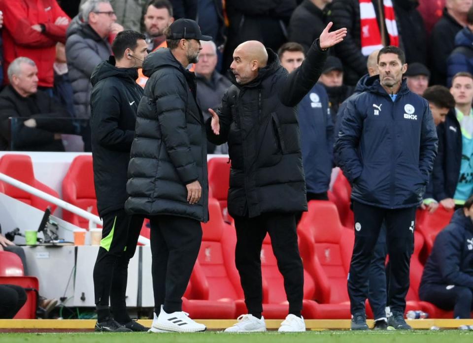 Jurgen Klopp and Pep Guardiola have an exchange of views on the touchline (Getty)