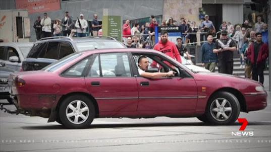 Gargasoulas did a series of burnouts outside Flinders Street Station before turning towards Bourke Street. Source: 7News