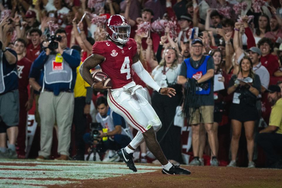 Sep 28, 2024; Tuscaloosa, Alabama, USA; Alabama Crimson Tide quarterback Jalen Milroe (4) scores a touchdown against the Georgia Bulldogs during the first quarter at Bryant-Denny Stadium. Mandatory Credit: Will McLelland-Imagn Images