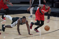 Portland Trail Blazers forward Robert Covington (23) steals the ball from San Antonio Spurs guard Lonnie Walker IV, left, during the second half of an NBA basketball game in San Antonio, Friday, April 16, 2021. (AP Photo/Eric Gay)