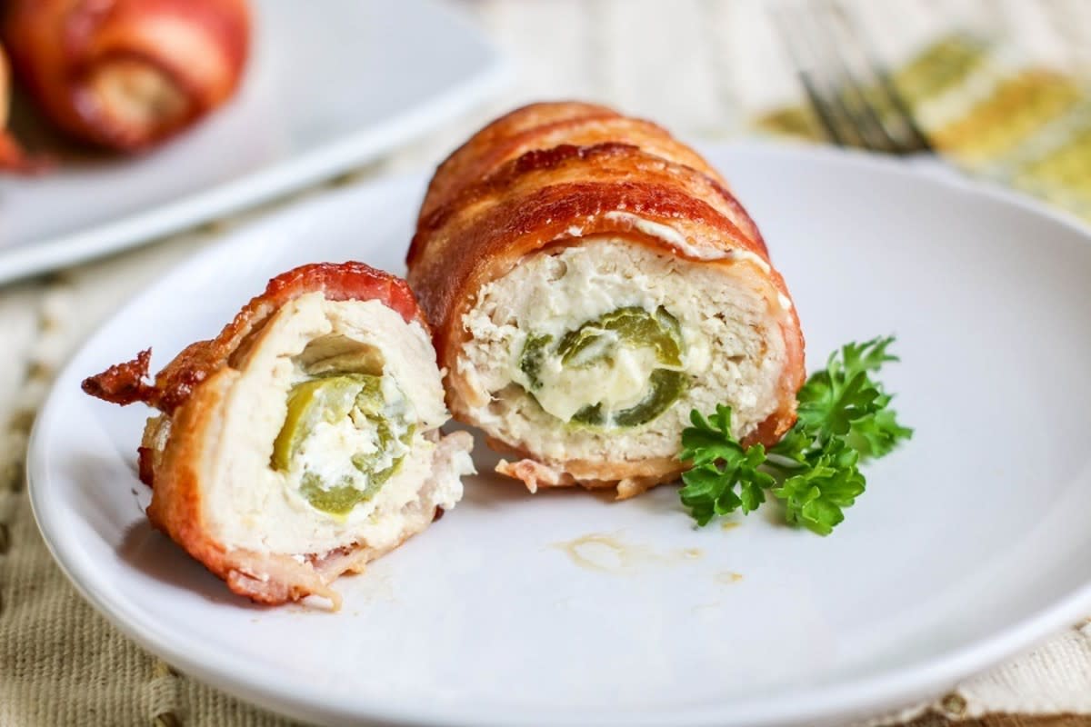 <p>Moore or Less Cooking</p><p>Flavorful Stuffed chicken breast filled with cheesy jalapenos wrapped in crispy bacon.</p><p><strong>Get the recipe: </strong><a href="https://mooreorlesscooking.com/air-fryer-bacon-wrapped-jalapeno-stuffed-chicken/" rel="nofollow noopener" target="_blank" data-ylk="slk:Air Fryer Bacon-Wrapped Jalapeno Stuffed Chicken;elm:context_link;itc:0;sec:content-canvas" class="link rapid-noclick-resp"><strong>Air Fryer Bacon-Wrapped Jalapeno Stuffed Chicken</strong></a></p>