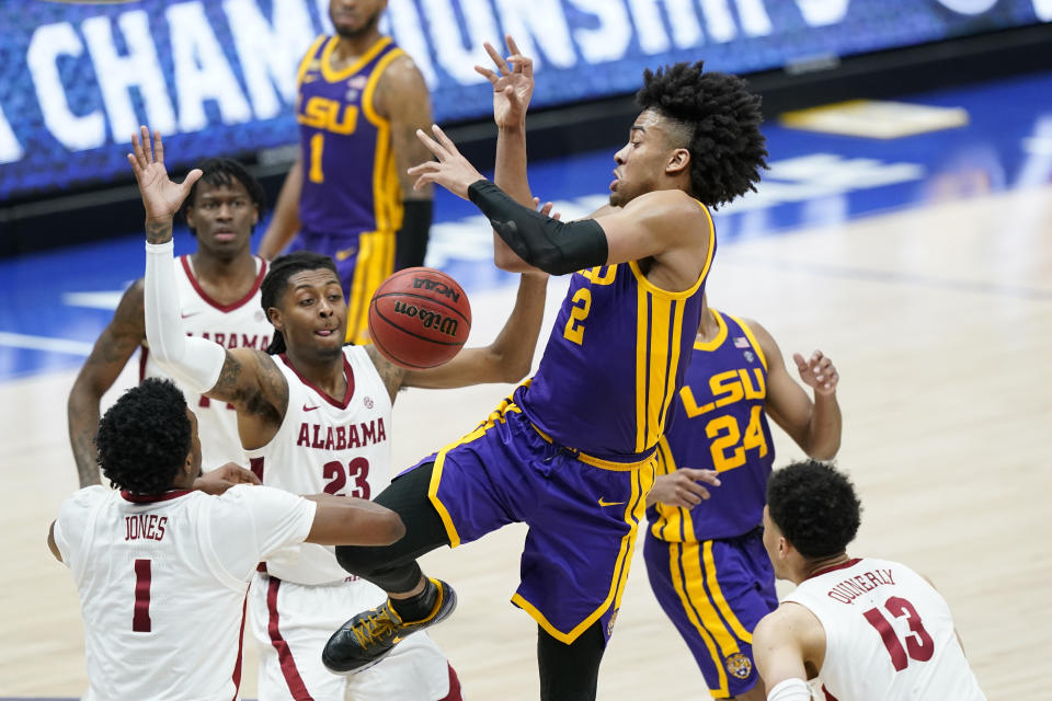 LSU's Trendon Watford (2) loses the ball as he drives against Alabama during the second half of the championship game at the NCAA college basketball Southeastern Conference Tournament Sunday, March 14, 2021, in Nashville, Tenn. (AP Photo/Mark Humphrey)