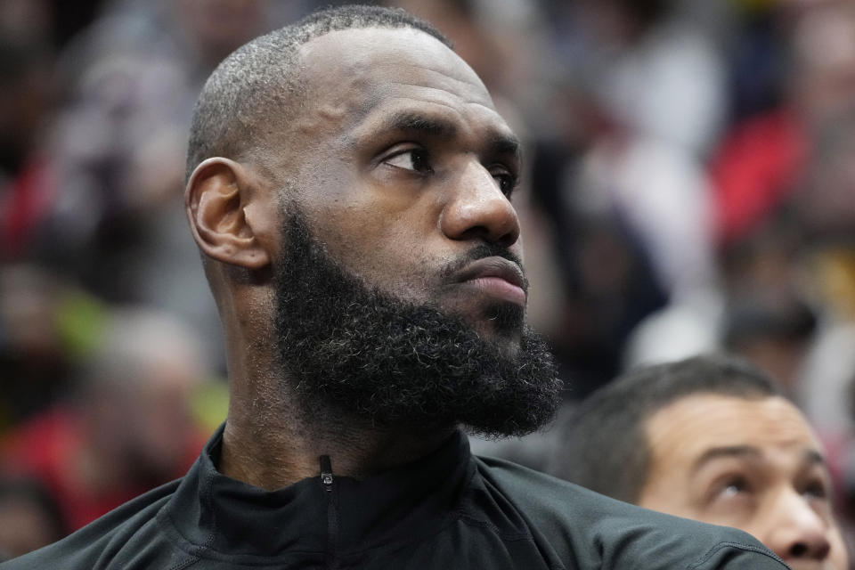 Los Angeles Lakers forward LeBron James reacts as he watches teammates during the second half of an NBA basketball game against the Chicago Bulls in Chicago, Wednesday, Dec. 20, 2023. The Bulls won 124-108. (AP Photo/Nam Y. Huh)