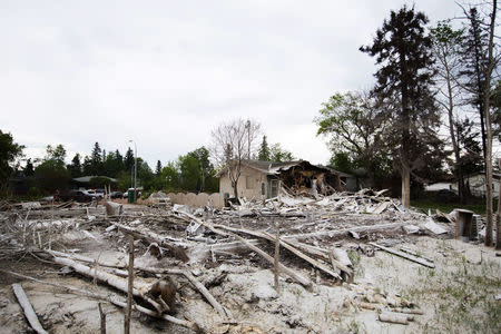 Destroyed houses are seen in the Lower Townsite neighborhood as thousands of evacuees who fled a massive wildfire begin to return to their homes in Fort McMurray, Alberta, Canada June 1, 2016. REUTERS/Topher Seguin