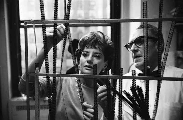 PHOTO: Broadcast journalist Barbara Walters looks at film negatives with an unidentified man behind the scenes at NBC Studios in New York, circa 1966. (Rowland Scherman/Getty Images)