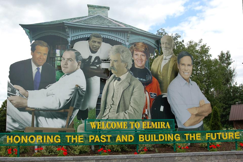 This sign featuring some of Elmira's most well known residents, including author Mark Twain, welcomes people coming into the city off Interstate 86.