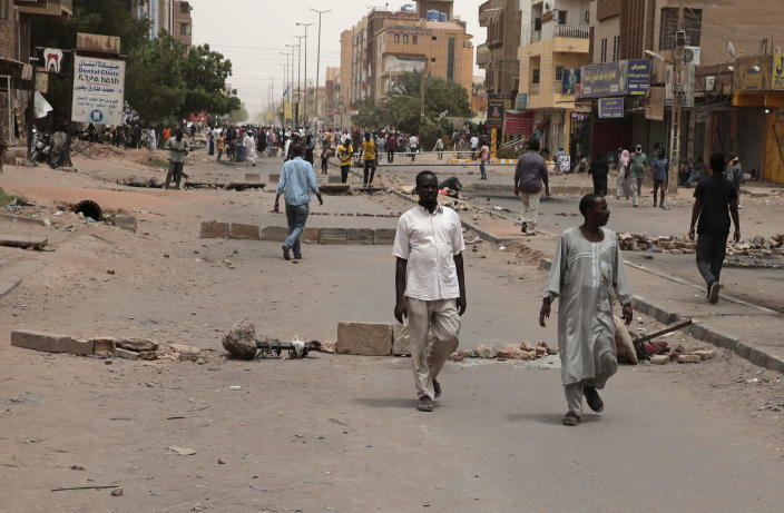Protesters block roads during a demonstration demanding a return to civilian rule and to protest the nine people who were killed in anti-military demonstrations last month, in Khartoum, Sudan, Monday, July 4, 2022. (AP Photo/Marwan Ali)