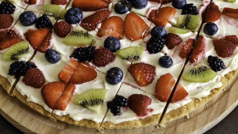Sliced sweet pizza with fruit