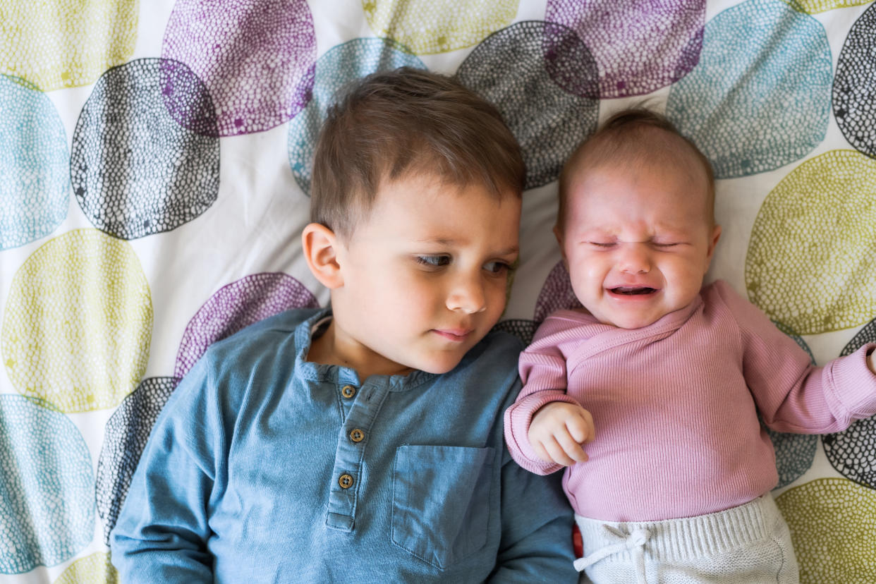 Before a new baby arrives, kids may think being an older sibling will be fun and exciting. Once baby arrives, however, it's normal for them to feel overwhelmed by the ways their world has changed. Experts say having honest conversations with kids is the best way to help them cope with a new baby. (Photo: Getty Creative)