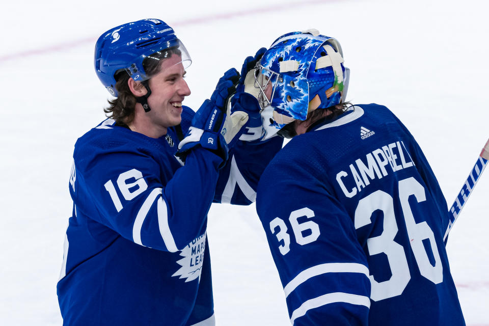 TORONTO, ON - APRIL 07: Toronto Maple Leafs Right Wing Mitchell Marner (16) congratulates Toronto Maple Leafs Goalie Jack Campbell (36) on his 10th win in a row to set a new franchise record after the NHL regular season game between the Montreal Canadiens and the Toronto Maple Leafs on April 7, 2021, at Scotiabank Arena in Toronto, ON, Canada. (Photo by Julian Avram/Icon Sportswire via Getty Images)