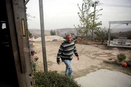 Elad Ziv enters his home in the Jewish settler outpost of Amona in the West Bank, November 22, 2016. REUTERS/Ronen Zvulun