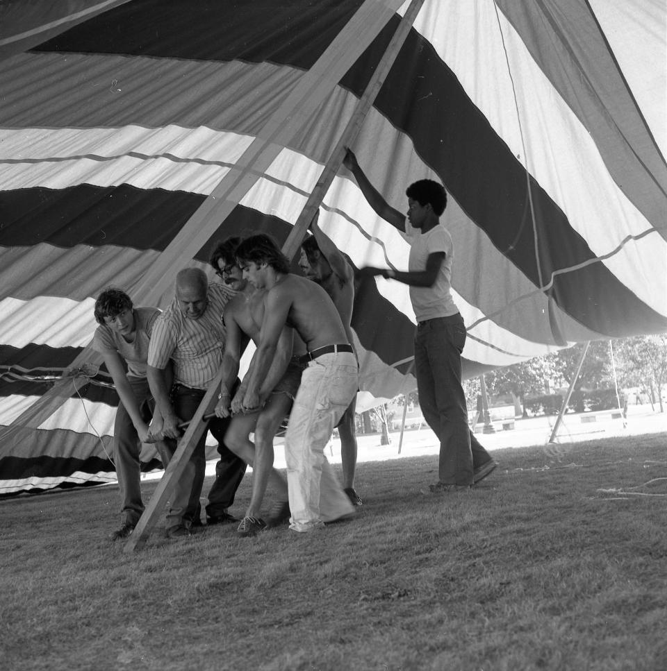 In 1974, volunteers raise the red, white and blue tent that would become the symbol of Prescott Park Arts Festival. This is one of many J.D. Lincoln photographs on exhibit at the Portsmouth Athenaeum starting Aug. 4.