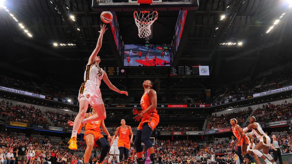 Clark drives to the basket during the game. - Ron Hoskins/NBAE/Getty Images