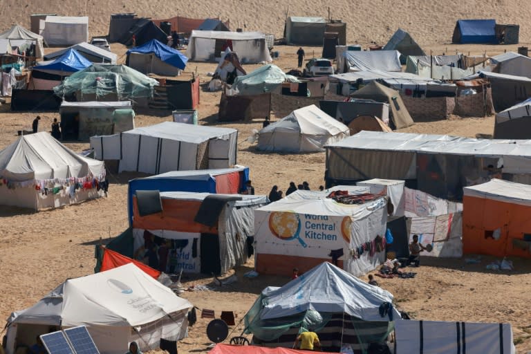 Palestinians' makeshift tents and a tent with the logo of World Central Kitchen in Rafah in the southern Gaza Strip on April 4, 2024 (MOHAMMED ABED)