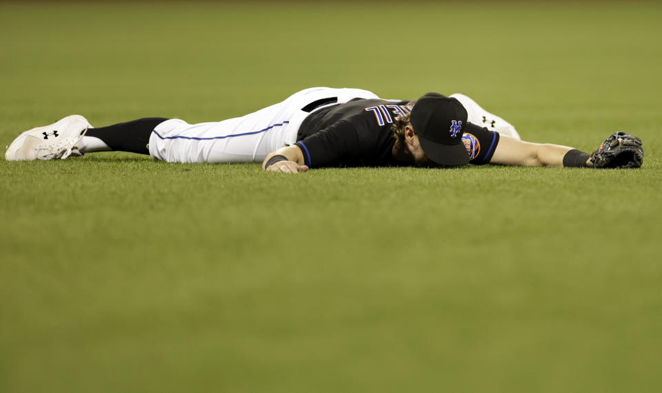 New York Mets second baseman Jeff McNeil reacts after being unable to field an RBI single hit by Washington Nationals' Alex Call during the fifth inning of a baseball game Friday, Sept. 2, 2022, in New York. (AP Photo/Adam Hunger)