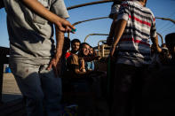 <p>A group of refugees from Mosul after being checked by the Intelligence Officers in Haman Al-Alil on their way to the refugee camps. Haman Al-Alil, Iraq. June 29, 2017. (Photograph by Diego Ibarra Sánchez / MeMo) </p>