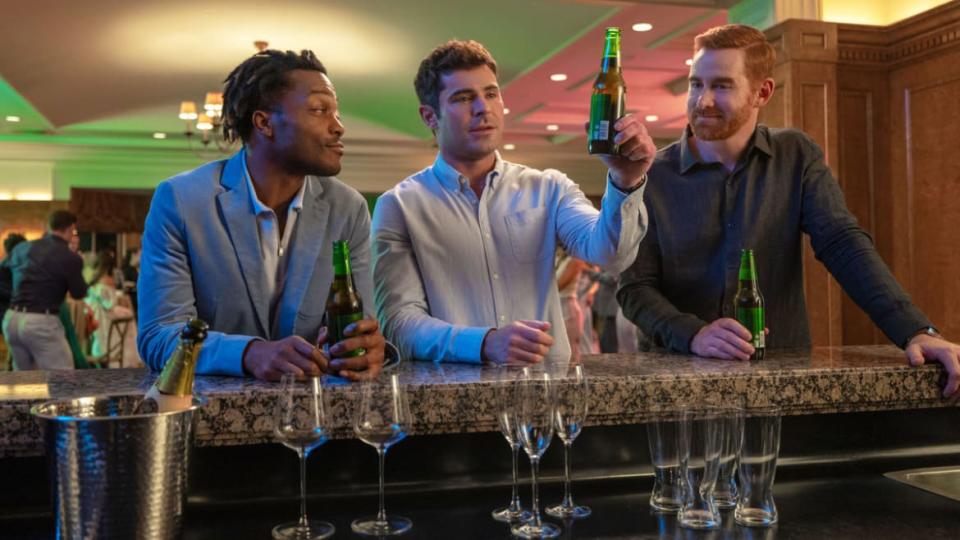 A photo including Jermaine Fowler as 'Wes', Zac Efron as 'Dean' and Andrew Santino as 'JT' in the film Ricky Stanicky on Amazon Prime Video