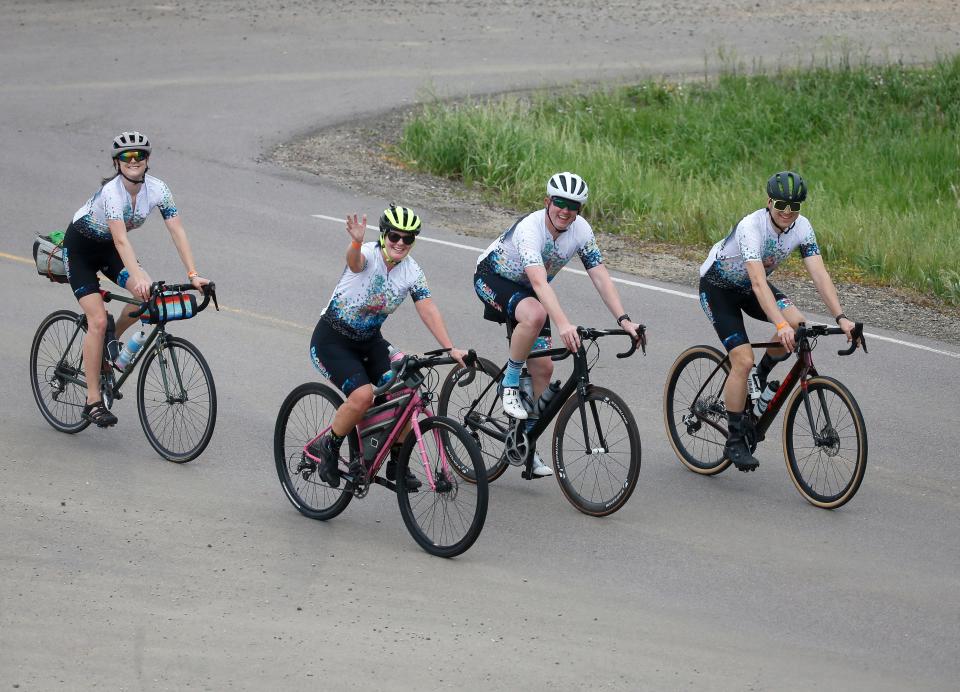 Members of the RAGBRAI route inspection team (from left) Andrea Parrott, Kathy Murphy, ride director Matt Phippen and Scott Olson, make their way along the route June 5.