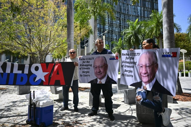 People protest demanding the "maximum sentence" for the former US Ambassador to Bolivia, Victor Manuel Rocha, who admitted to spying for Cuba, outside a courthouse in Miami, Florida on April 12, 2024 (CHANDAN KHANNA)