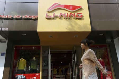 A woman walks past a Li Ning sportswear store in Huaibei, Anhui province in this October 17, 2012 file picture. REUTERS/China Daily