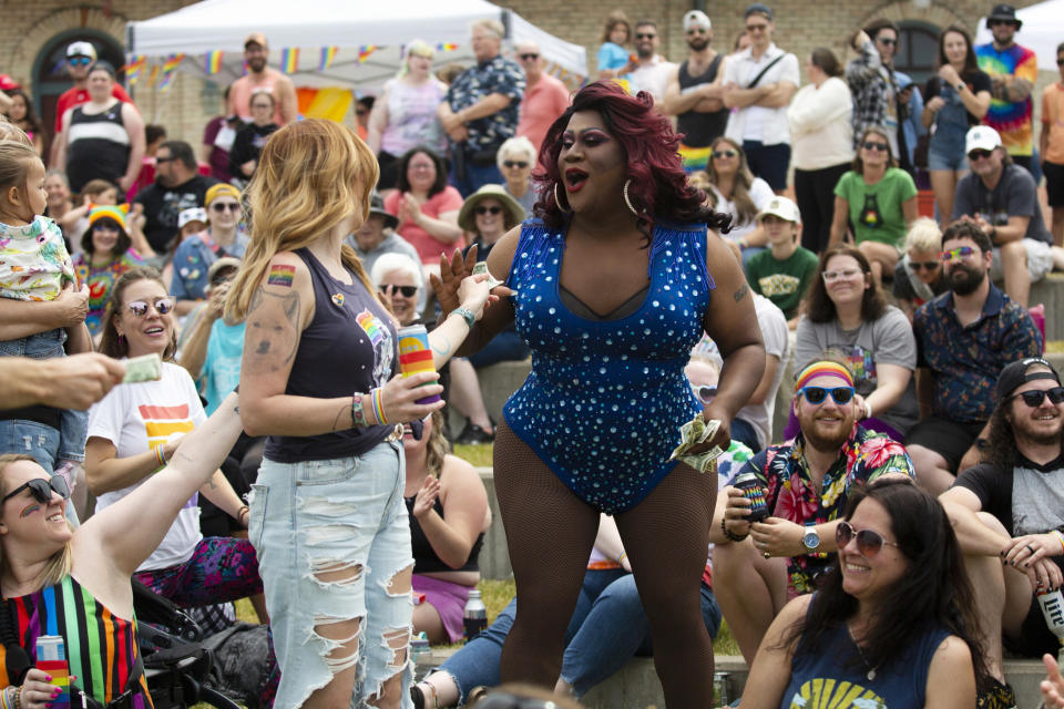 Dee Dee Chaunte is seen preforming during a drag show at the Lynne Sherwood Waterfront Stadium in Grand Haven, Mich., on Saturday, June 10, 2023. The festival — which organizers had hoped would attract at least 500 attendees — drew thousands of people from all over who came to experience the first-time event's drag show, dance party and vendor-filled streets. (AP Photo/Kristen Norman)