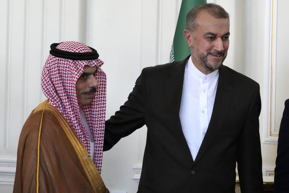 Iranian Foreign Minister Hossein Amirabdollahian, right, and his Saudi counterpart Prince Faisal bin Farhan leave after their joint press briefing in Tehran, Iran, Saturday, June 17, 2023. Saudi Arabia’s top diplomat has arrived in the Iranian capital,Tehran, the latest step in the restoration of diplomatic ties between the two Mideast rivals, Iranian state media reported. (AP Photo/Vahid Salemi)