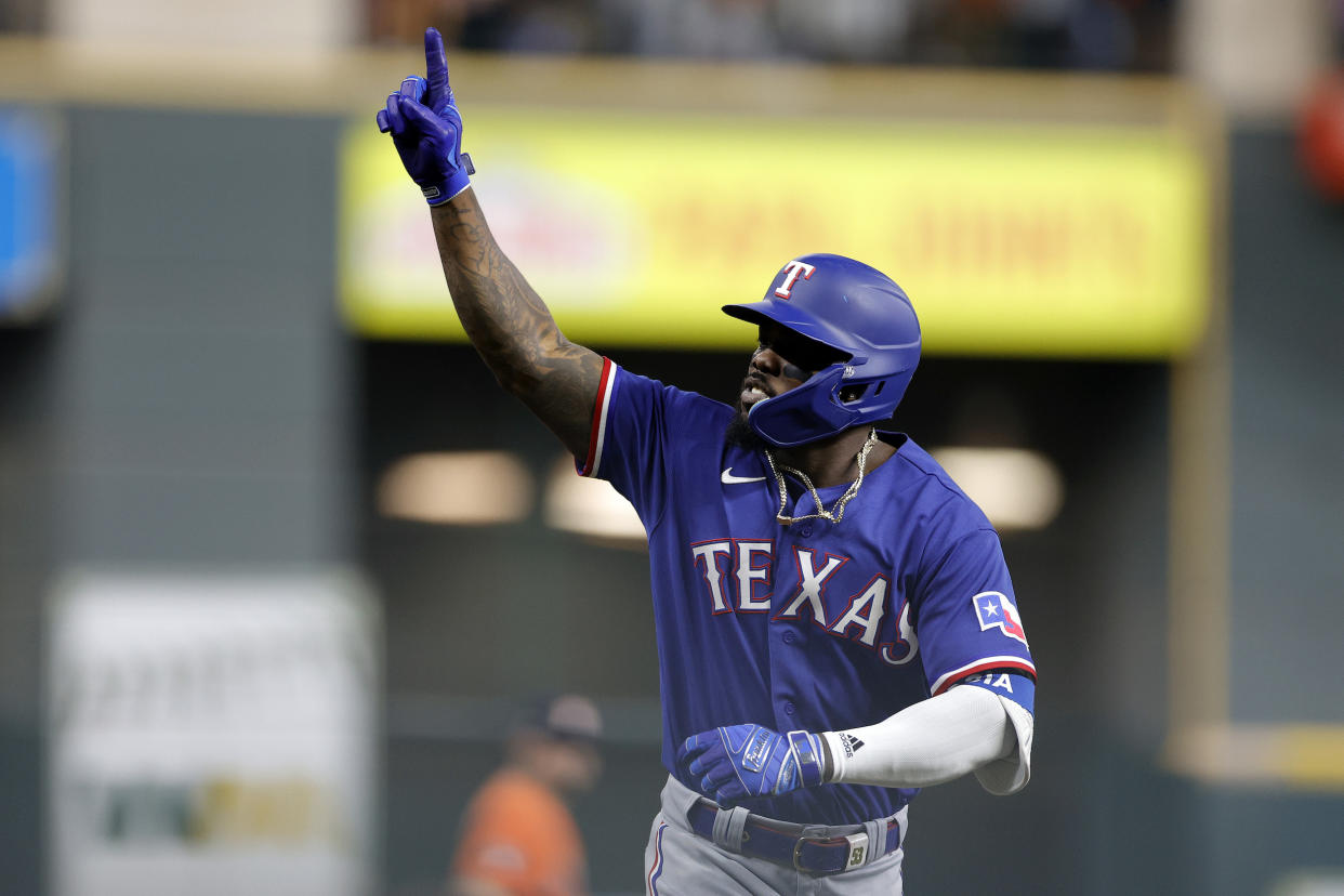 Adolis García put the game away with a ninth-inning grand slam. (Carmen Mandato/Getty Images)