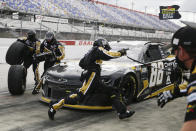 Alex Bowman (88) makes a pit stop during the NASCAR Cup Series auto race Sunday, May 17, 2020, in Darlington, S.C. (AP Photo/Brynn Anderson)