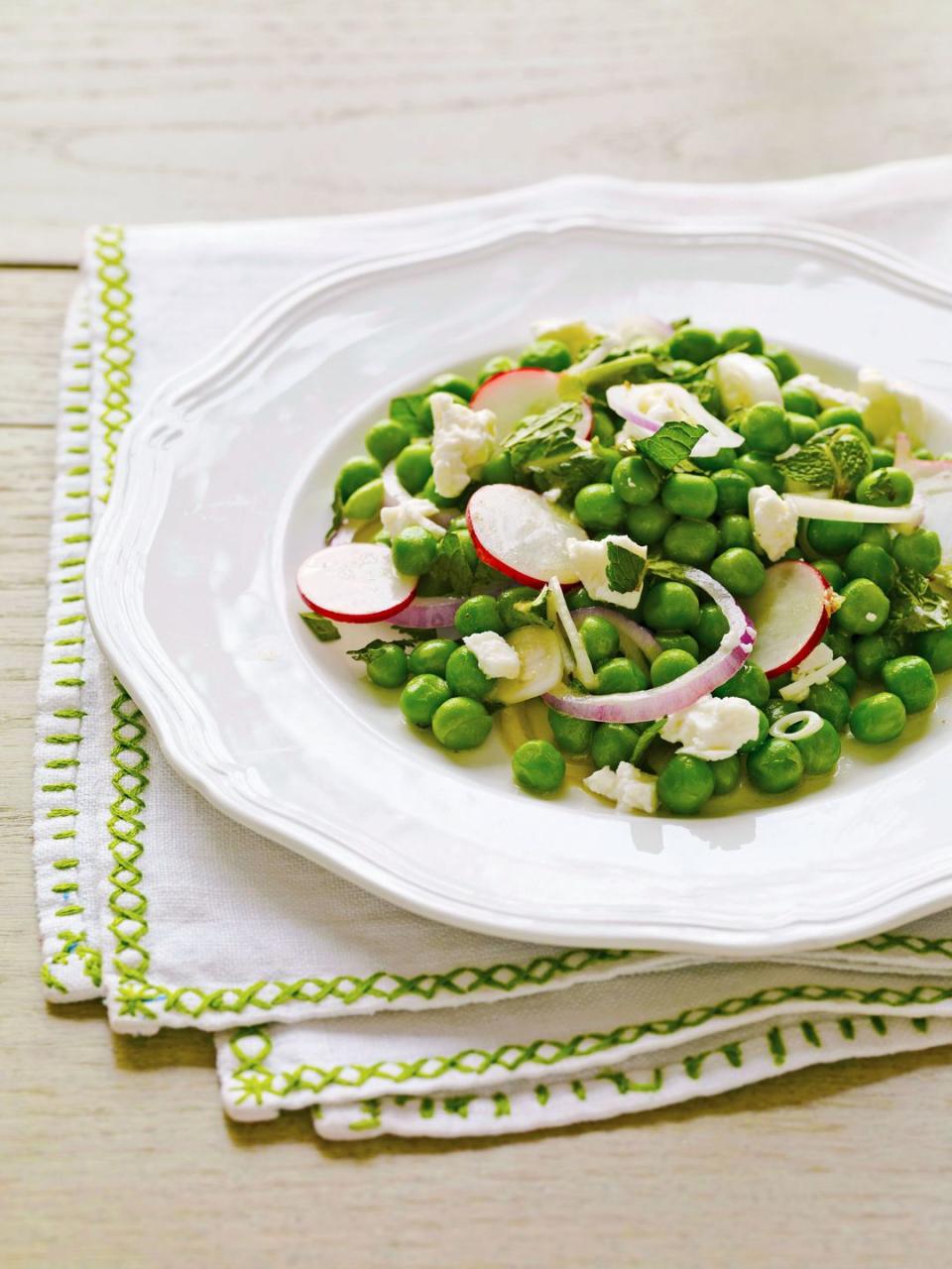 feta and pea salad on a white plate
