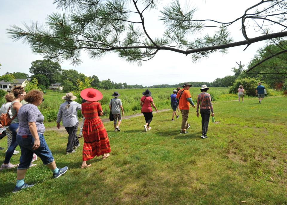 A group walks through a section of Merrymount Park in Quincy during a tour led by Quincy Mayor Thomas Koch, Sunday, July 9, 2023. Tom Gorman/For The Patriot Ledger