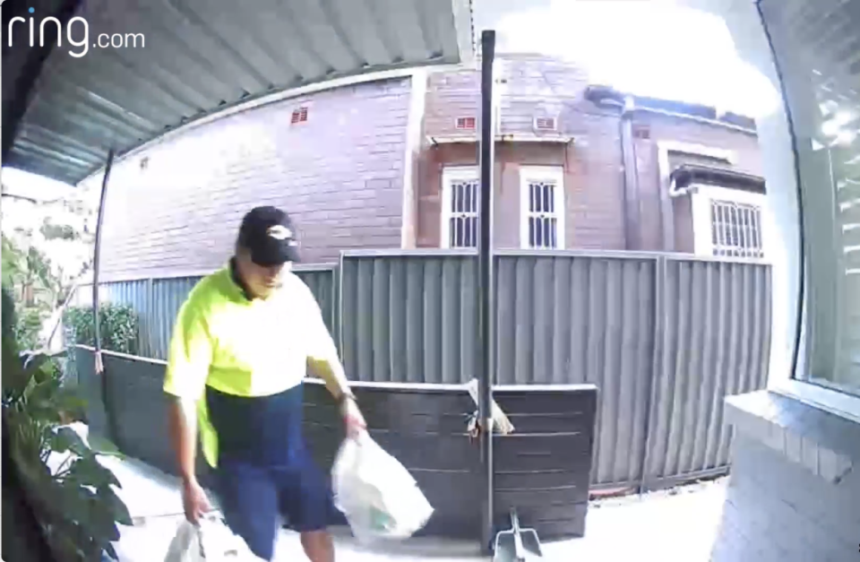Woolworths delivery driver putting groceries in front of house door before departing without notice.