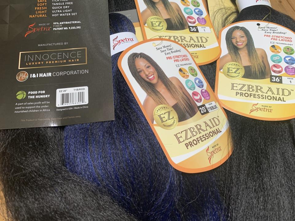 Samples of Pre-stretched Innocence EZBRAND Professional Antibacterial Braid hair extensions from I&I Hair Corporation, purchased in May, are seen in this photo in New York on Wednesday, July 1, 2020. Federal authorities in New York on Wednesday seized a shipment of weaves and other beauty accessories from I&I and other importers suspected to be made out of human hair taken from people locked inside a Chinese internment camp. (AP Photo/Wong Maye-E)
