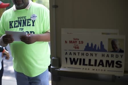 A t-shirt and campaign poster represent both Philadelphia mayoral candidates Jim Kenney and Tony Williams at Settlementt Music School voting station during a special primary election in Philadelphia, Pennsylvania on May 19, 2015. REUTERS/Mark Makela