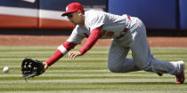 St. Louis Cardinals center fielder Jon Jay (19) comes up short fielding Danile Murphy's sixth-inning RBI double in a baseball game against the New York Mets in New York, Thursday, April 24, 2014. (AP Photo/Kathy Willens)