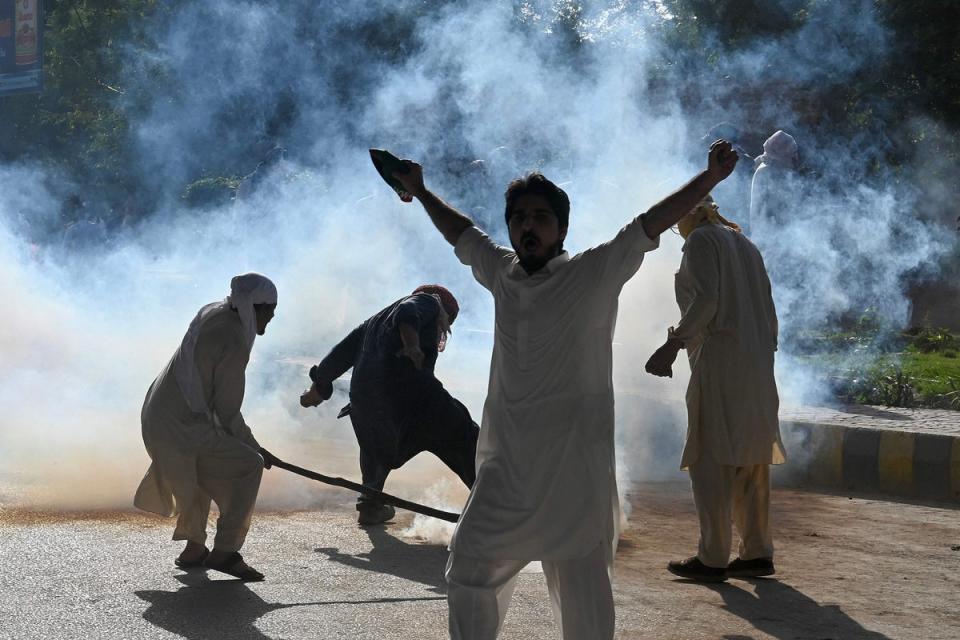 Pakistan Tehreek-e-Insaf (PTI) party activists in Peshawar protest against Imran Khan’s arrest (AFP via Getty Images)