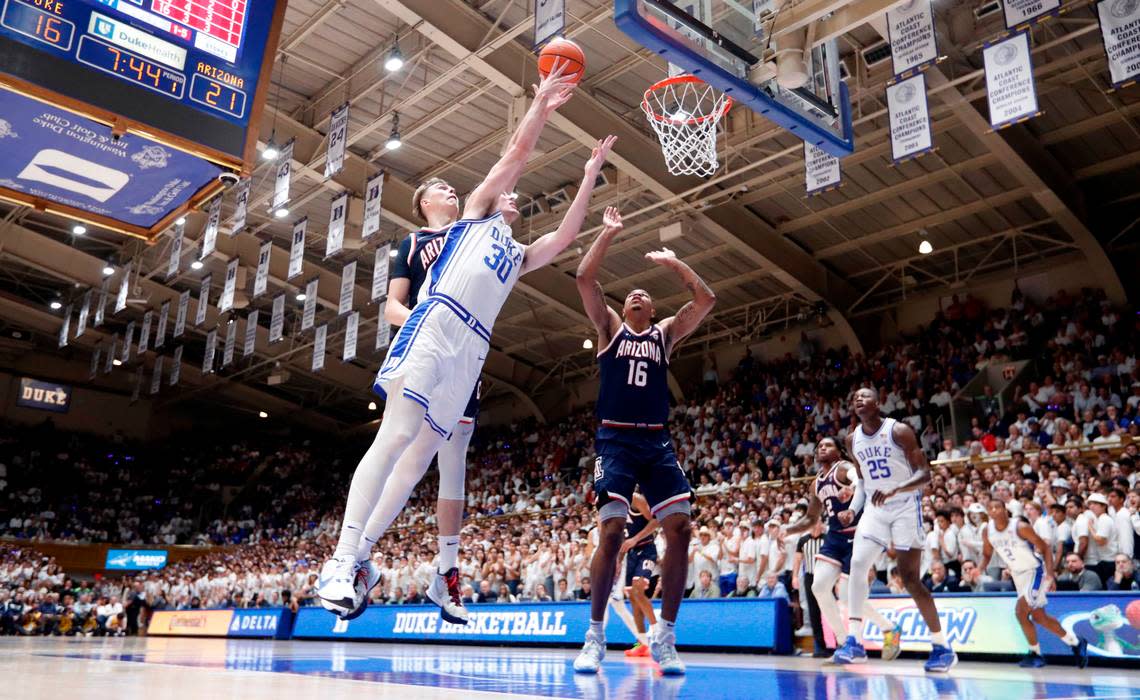 Duke’s Kyle Filipowski (30) heads to the basket as Arizona’s Motiejus Krivas (14) defends during Arizona’s 78-73 victory over Duke at Cameron Indoor Stadium in Durham, N.C., Friday, Nov. 10, 2023.