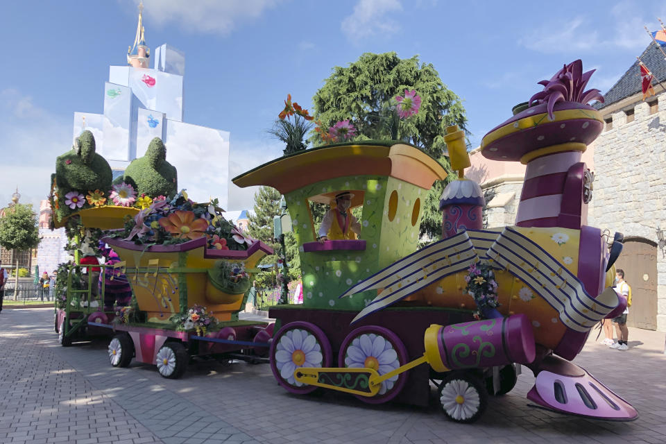 A float rides in Disneyland Paris in Marne-la-Vallée, east of Paris, Thursday, June 17, 2021. France's tourism sector takes a further step toward post-pandemic recovery with the reopening of Disneyland Paris, two weeks after the country formally welcomed back vaccinated foreign visitors. (AP Photo/Catherine Gaschka)