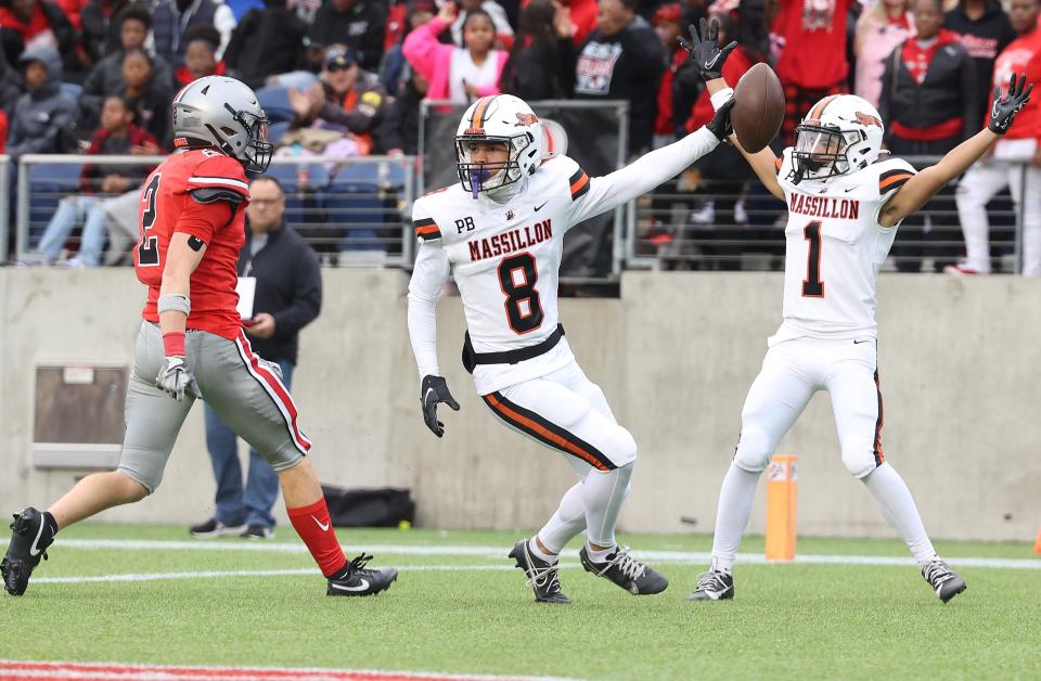 Massillon receiver Emy Louis Jr. scores a first half touchdown over McKinley defender Alex Vazquez as teammate Braylyn Toles ,1, celebrates at Tom Benson Hall of Fame Stadium Saturday , October 21, 2023.