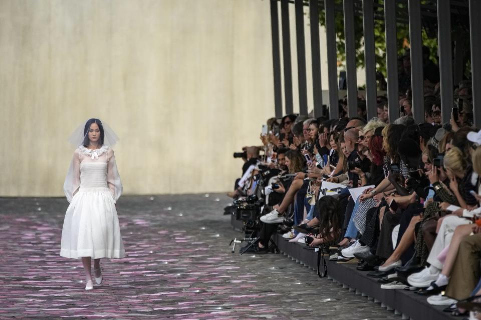 A model wears a creation for the Chanel Haute Couture Fall/Winter 2023-2024 fashion collection presented in Paris, Tuesday, July 4, 2023. (AP Photo/Christophe Ena)