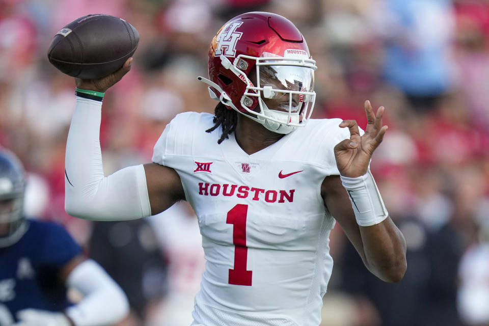 Houston quarterback Donovan Smith throws a pass during the first half of an NCAA college football game against Rice, Saturday, Sept. 9, 2023, in Houston. (AP Photo/Eric Christian Smith)